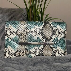 The Limited Snakeskin Clutch in Teal and Black